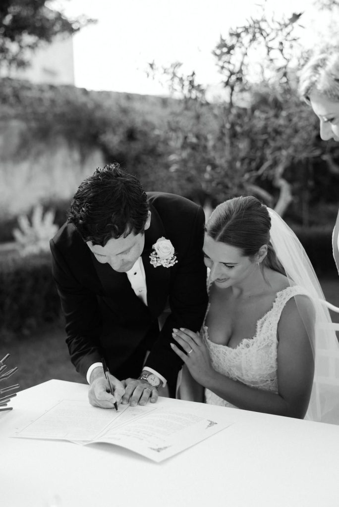 An Australian couple signs the Italian marriage certificate at the end of the ceremony.
