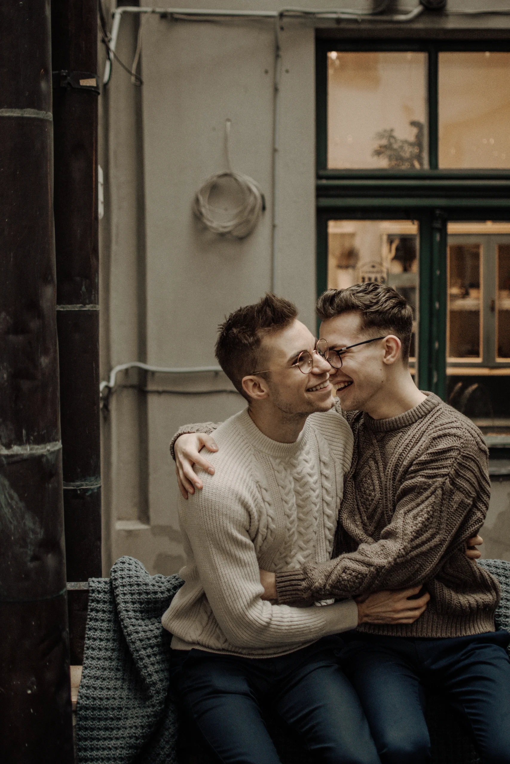 Two guys hugging each other.