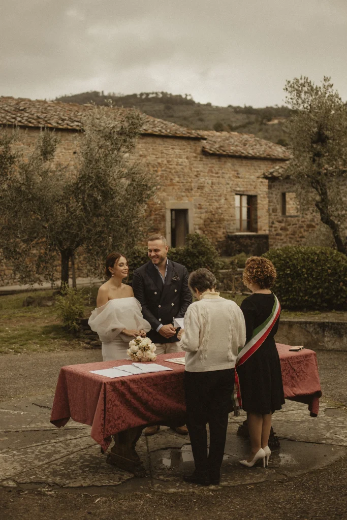 An American couple celebrates their civil wedding ceremony in the picturesque region of Tuscany.
