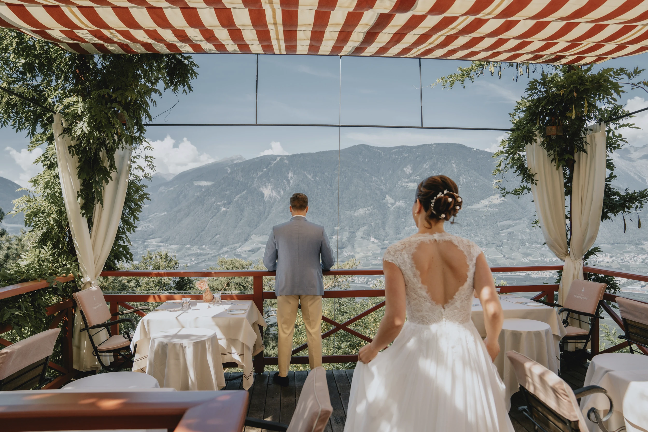 A foreign couple gettin married in Italy on a terrace before the rite.