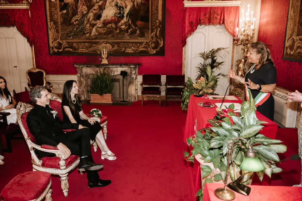Two American citizens getting legally married in the Sala Rossa of Florence City Hall