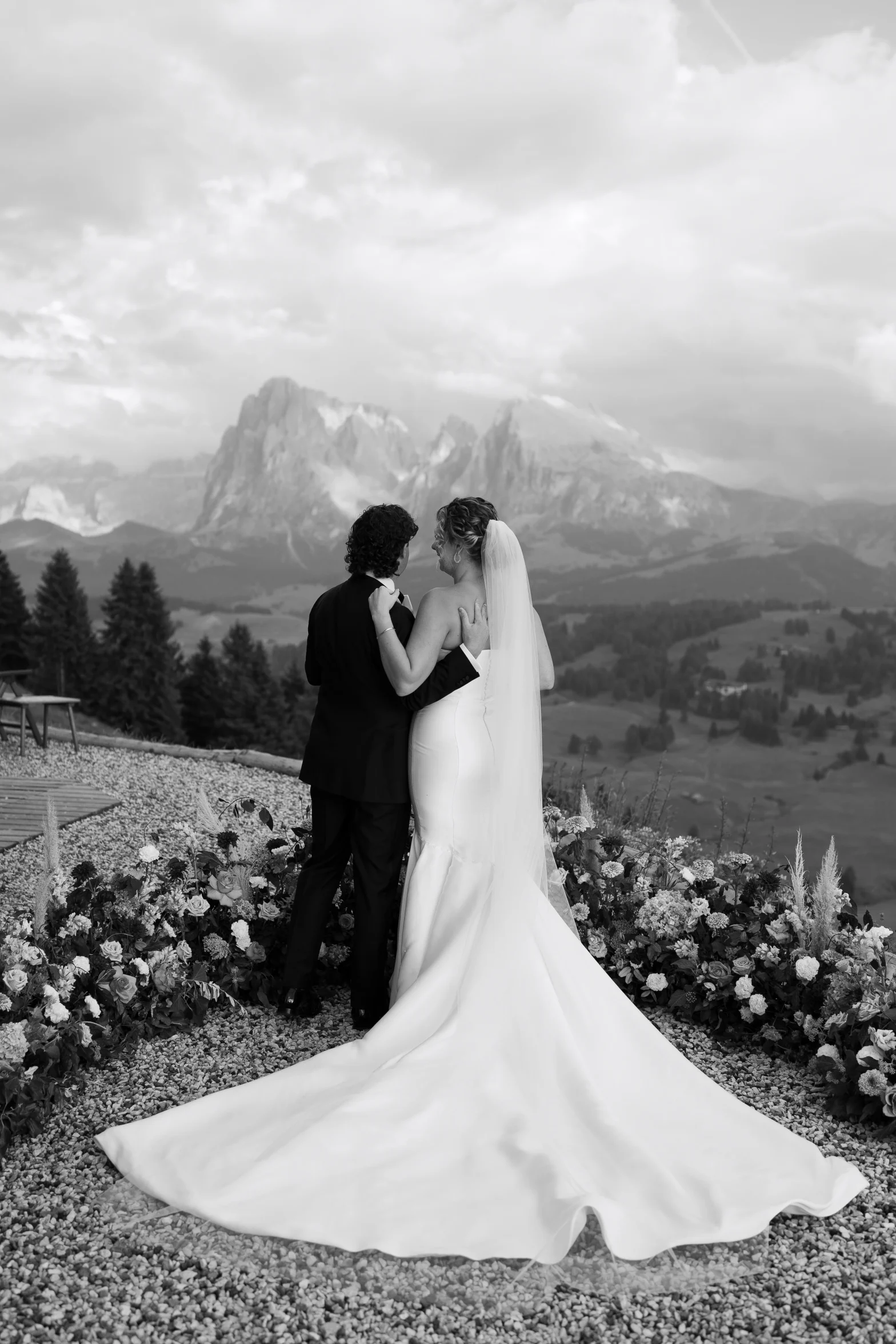 A couple look at the mountains after an outdoor civil wedding