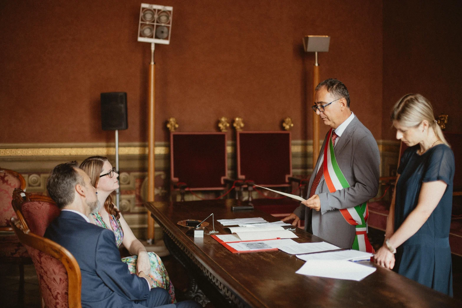 A couple before the Mayor of the Municipality of Siena during a Civil Wedding