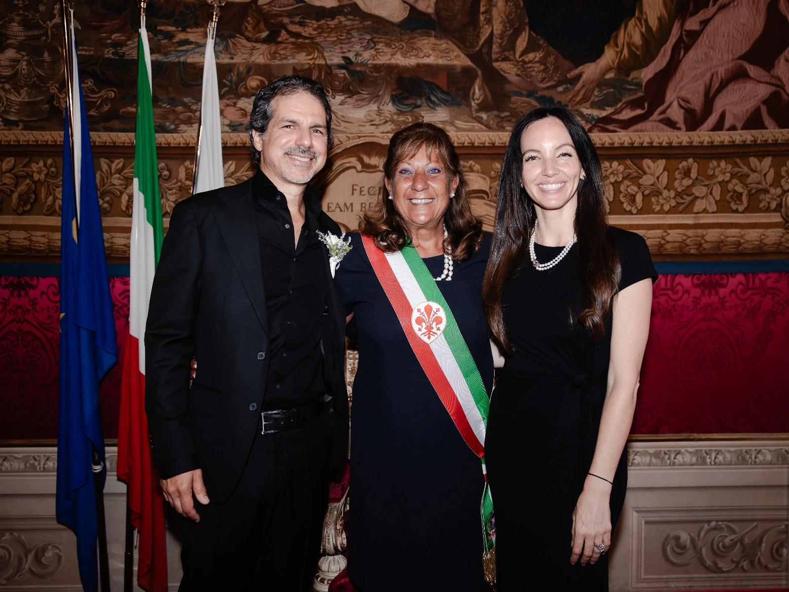 American citizens posing for a photo with the Mayor after their civil wedding ceremony in Florence.